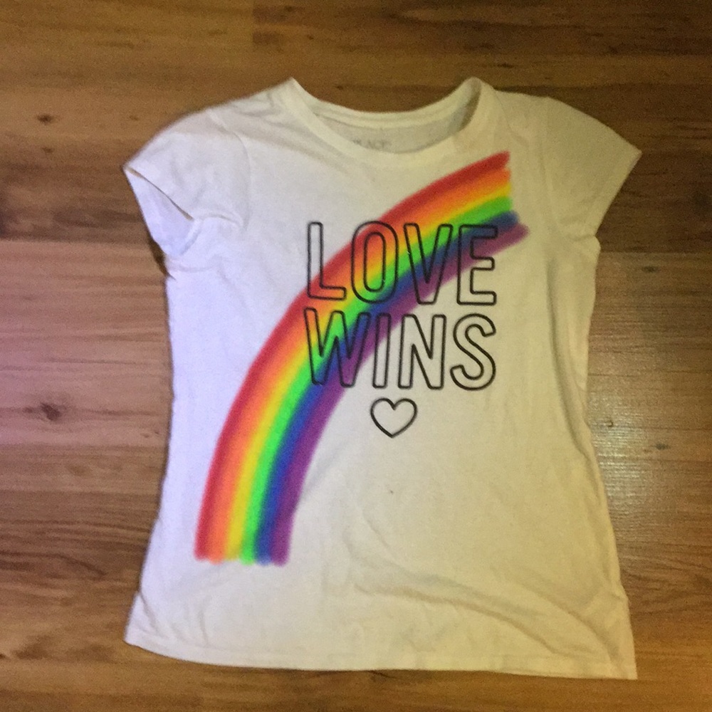 We are selling this rainbow love wins graphic tee!
